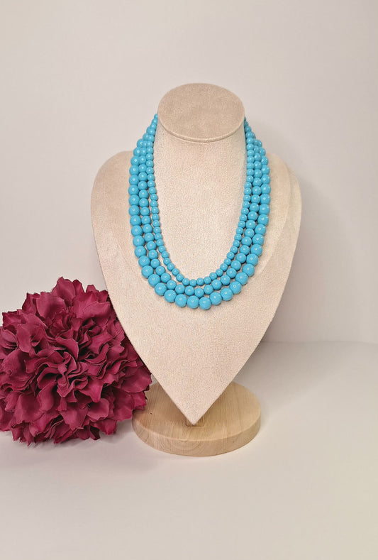 Collar triple vuelta